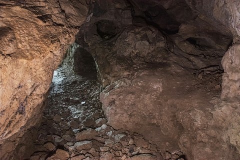 Access to the rock-strewn cave is not easy