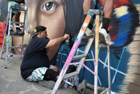 Urban artists create murals in the traveling Pigmen Trip festival, held for eight years in different locations in El Salvador