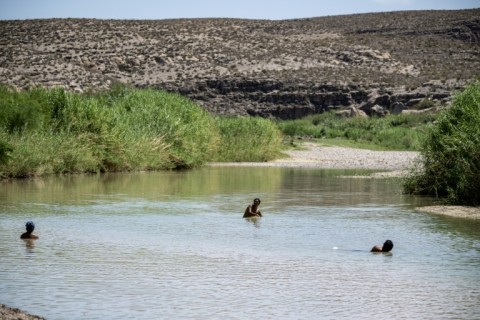 Tourists swim in the Rio Grande, on the US-Mexico border inside Big Bend National Park