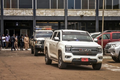 A police vehicle carrying Jewel Howard-Taylor leaves the Monrovia City Court