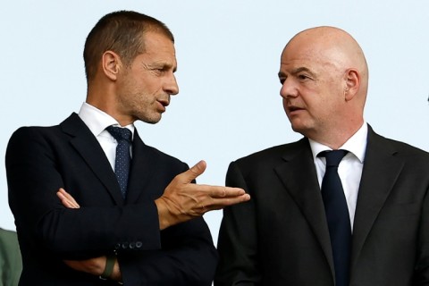 UEFA president Aleksander Ceferin speaks with FIFA president Gianni Infantino during a match at Euro 2024 in Germany