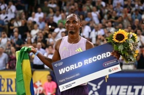 Brazil's Alison Dos Santos celebrates after winning the 400m hurdles in a world record at the Zurich Diamond League