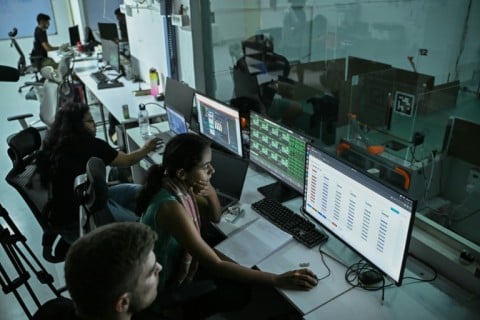 Employees monitor a cancer detection test inside a laboratory at the Dognosis facility in Kempohalli village on the outskirts of Bengaluru