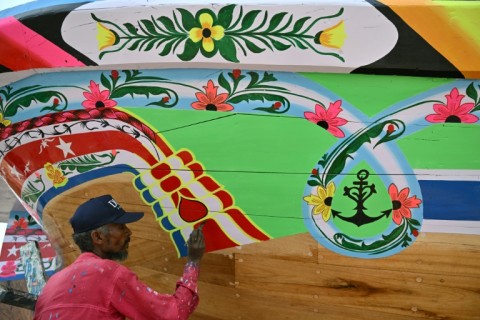 The completed boats are given splashes of colour