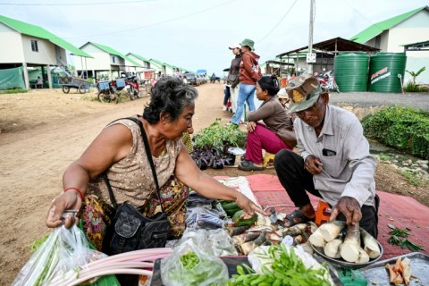 Residents of Cambodia's 'waiting village' have set up coffee shops, salons and grocery stores as they try to rebuild their lives