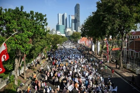 Protesters take part in an anti-LGBTQ rally organised by pro-Islamic organisations in Surabaya