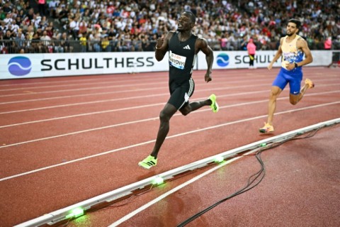 Kenya's Emmanuel Wanyonyi (L) and Algeria's Djamel Sedjati