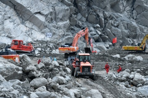 Excavators work during recovery efforts at the site of the destroyed Gyirong Port border crossing in China’s western Tibet region