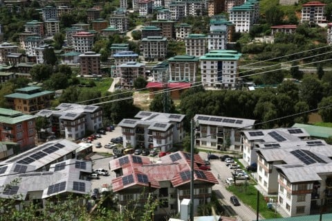Solar panels on rooftops of buildings in Bhutan's capital city of Thimphu