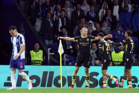 Erling Haaland celebrates after scoring for Manchester City in their win away to Portuguese champions Porto