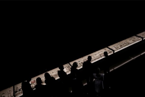 Britain's King Charles III and Britain's Queen Camilla alongside France's President Emmanuel Macron and his wife Brigitte Macron view sections of the Bayeux Tapestry during a preview event for the Bayeux Tapestry Exhibition, at the British Museum