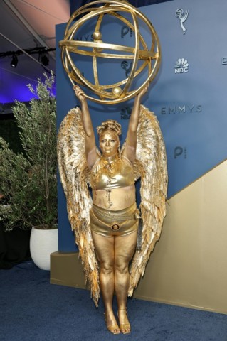 Meg Stalter dressed like an Emmy for the Emmy Awards