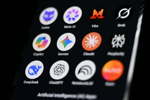 This photograph shows a handheld smartphone displaying the icons of some of the main artificial intelligence based apps, including LLMs, chatbots and generative AI.