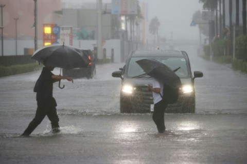 Flights scrapped, evacuations urged as Typhoon Dujuan wallops Japan