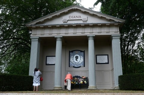 Well-wishers leave flowers at a memorial to Diana in the grounds of her ancestral home Althorp House in central England on the 29th anniversary of her death