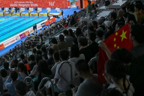 China topped the medals table near the end of the third day at the Asian Games, well clear of hosts Japan
