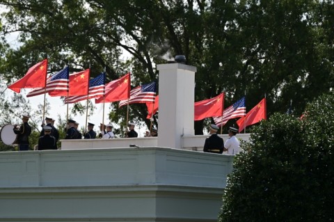 Members of the US military honor guard carry US and Chinese flags as they rehearse ahead of China's President Xi Jinping’s upcoming visit to the White House