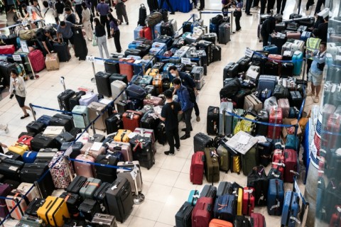 Passenger baggage from Thai Airways flights crowded Suvarnabhumi airport in Bangkok after flooding disrupted the airline's ground services