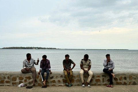 Residents spend their morning on a beach next to the port in Nadi on October 4, 2026, ahead of the Pacific Pre-COP31 Summit's opening ceremony.