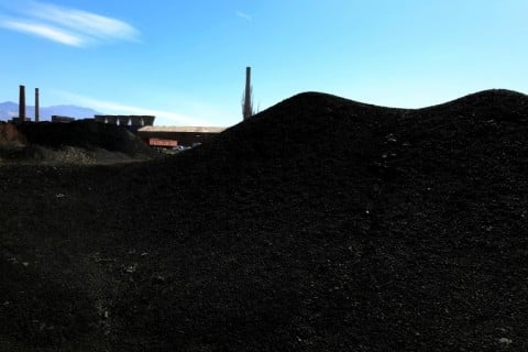 Hills of soot-black waste dot the landscape around the Elbasan steelworks complex