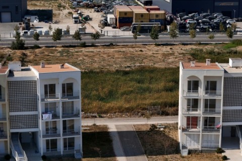 The stacked containers of toxic waste have been stored close to homes