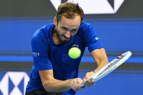 Russia's Daniil Medvedev hit the ball with a backhand into the stands after he failed to return a shot by Novak Djokovic in their China Open clash