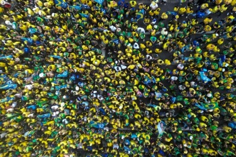 Ahead of the debate, thousands of supporters of Flavio Bolsonaro gathered for a campaign rally along Sao Paulo's Paulista Avenue, dressed in the yellow and green of the Brazilian flag