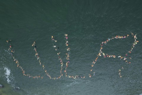 In Rio de Janeiro, swimmers at Praia Vermelha arranged themselves in the water to spell out Lula's name