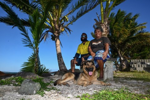 Residents spend the afternoon by the shoreline on Serua Island, Fiji, a low-lying community facing the growing threat of rising sea levels and coastal erosion