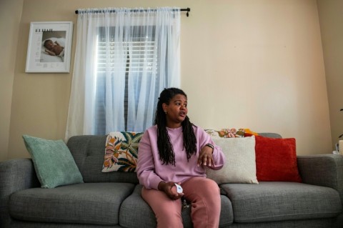 Luz Marte, a 38-year-old lab technician, bought her house a year ago, without realizing the site was a data center; "It sounds very loud, like an airplane is going to take off," she told AFP as her rambunctious three-year-old son played