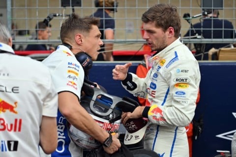 Red Bull Racing's Dutch driver Max Verstappen (R)