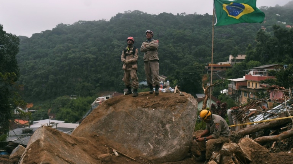 Firefighters are seen during rescue efforts after a huge landslide in Petropolis, Brazil, on February 19, 2022