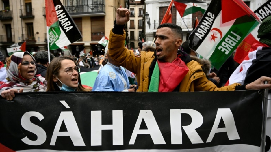 Demonstrators wave Western Sahara flags during a protest against the Spanish government support for Morocco's autonomy plan for Western Sahara, in Madrid, on March 26, 2022