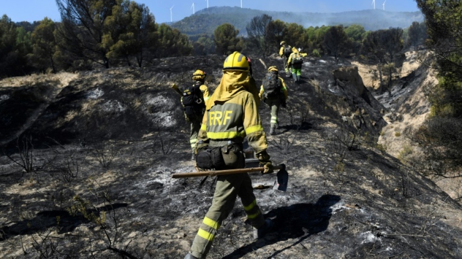 Firefighters put out a wildfire in the Moncayo Natural Park in the northern region of Aragon on August 15 last year.  