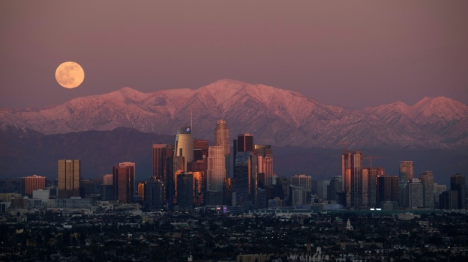 The San Gabriel Mountains loom over the Los Angeles skyline 