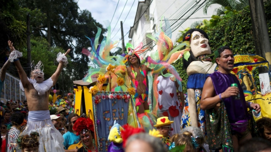 Members of the 'Heaven on Earth' street carnival band parade through the streets of Santa Teresa, in Rio de Janeiro