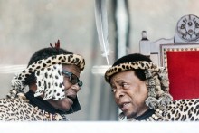 Inkatha Freedom Party ( IFP) leader Prince Mangosuthu Buthelezi (L) and Zulu King Goodwill Zwelithini (R) chat at The Moses Mabhida Football Stadium in Durban on October 7, 2018, during Umkhosi Welembe, an annual commemoration of Zulu King Shaka ka Senzangakhona, a revered military strategist who united the tribes to form the Zulu Nation.