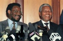 African National Congress (ANC) President Nelson Mandela (R) shares a laugh with Zulu's Inkatha Freedom Party leader Mangosuthu Buthelezi during a joint media conference at Durban after their day-long meeting in Durban, 01 March 1994.