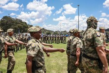 Members of the South African Police Service (SAPS) Special Task Force march during the Integrated Law Enforcement parade near the Nasrec Expo Centre in Johannesburg, on November 19, 2025.