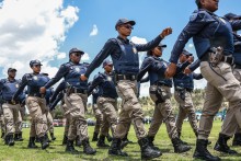 Members of the Johannesburg Metro Police Department (JMPD) march during the Integrated Law Enforcement parade near the Nasrec Expo Centre in Johannesburg, on November 19, 2025.