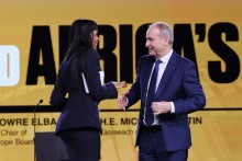 Sabrina Elba and Micheál Martin, Ireland’s Taoiseach, Prime Minister of Ireland speak on stage during Global Citizen NOW: Johannesburg on November 21, 2025 in Johannesburg, South Africa.