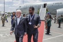 Brazil's President Luiz Inacio Lula da Silva (C-L) is welcomed by South Africa's Higher Education Minister Buti Manamela (C-R) upon his arrival at the OR Tambo International airport in Ekurhuleni on November 21, 2025 ahead of the G20 leader's Summit.
