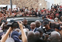 Economic Freedom Fighters (EFF) leader Julius Malema (C) arrives at the KuGompo City Regional court in East London on April 15, 2026 for his sentencing for firing an assault rifle at a rally eight years ago.