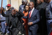 Economic Freedom Fighters (EFF) leader Julius Malema (CR) and his wife Mantwa Malema (CL) leave the KuGompo City Regional court in East London on April 15, 2026 following his sentencing for firing an assault rifle at a rally eight years ago.