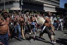 Protestors walk on a street during a protest march against undocumented migrants organised by “March and March” in Johannesburg on April 29, 2026.