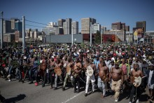Protestors walk on a street during a protest march against undocumented migrants organised by “March and March” in Johannesburg on April 29, 2026.