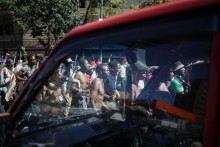 Protestors walk on a street during a protest march against undocumented migrants organised by “March and March” in Johannesburg on April 29, 2026.
