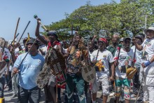 Protestors from the anti-illegal immigration group, March and March Movement chant slogans and march outside the Department of Home Affairs Refugee Reception Centre during a demonstration at the Che Guevara Road in Durban, on October 8, 2026.