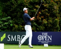 Sihwan Kim of the US hits a shot during round three of golf's Singapore Open on Saturday