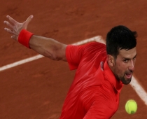 'Ban was mistake': Novak Djokovic returns the ball to Japan's Yoshihito Nishioka in his first round match at the French Open on Monday